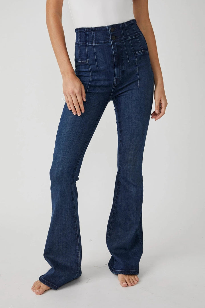 Trendy high rise jeans by Free People, made from flexible denim fabric, perfect for a fashionable and comfortable fit.