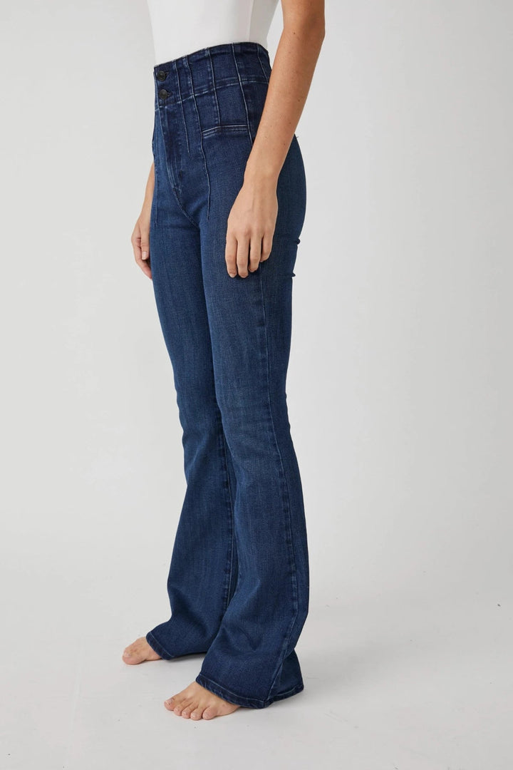 Trendy high rise jeans by Free People, made from flexible denim fabric, perfect for a fashionable and comfortable fit.